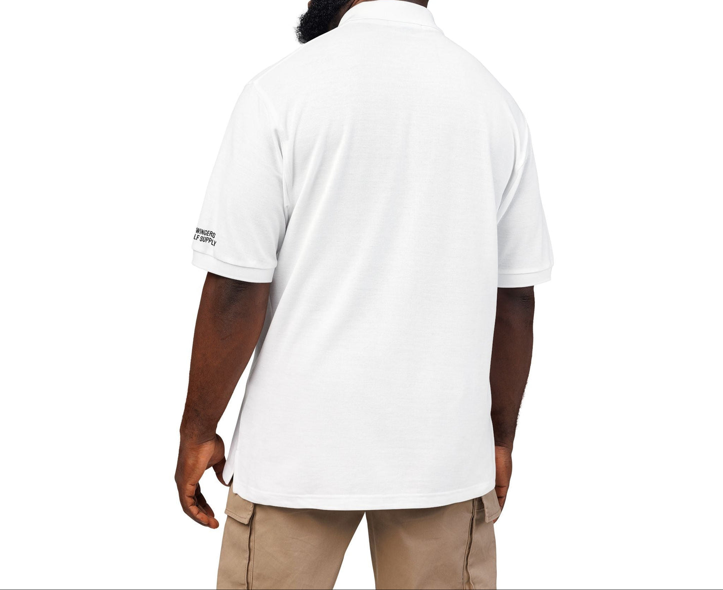 Man wearing a white polo shirt with a visible brand logo on a white background