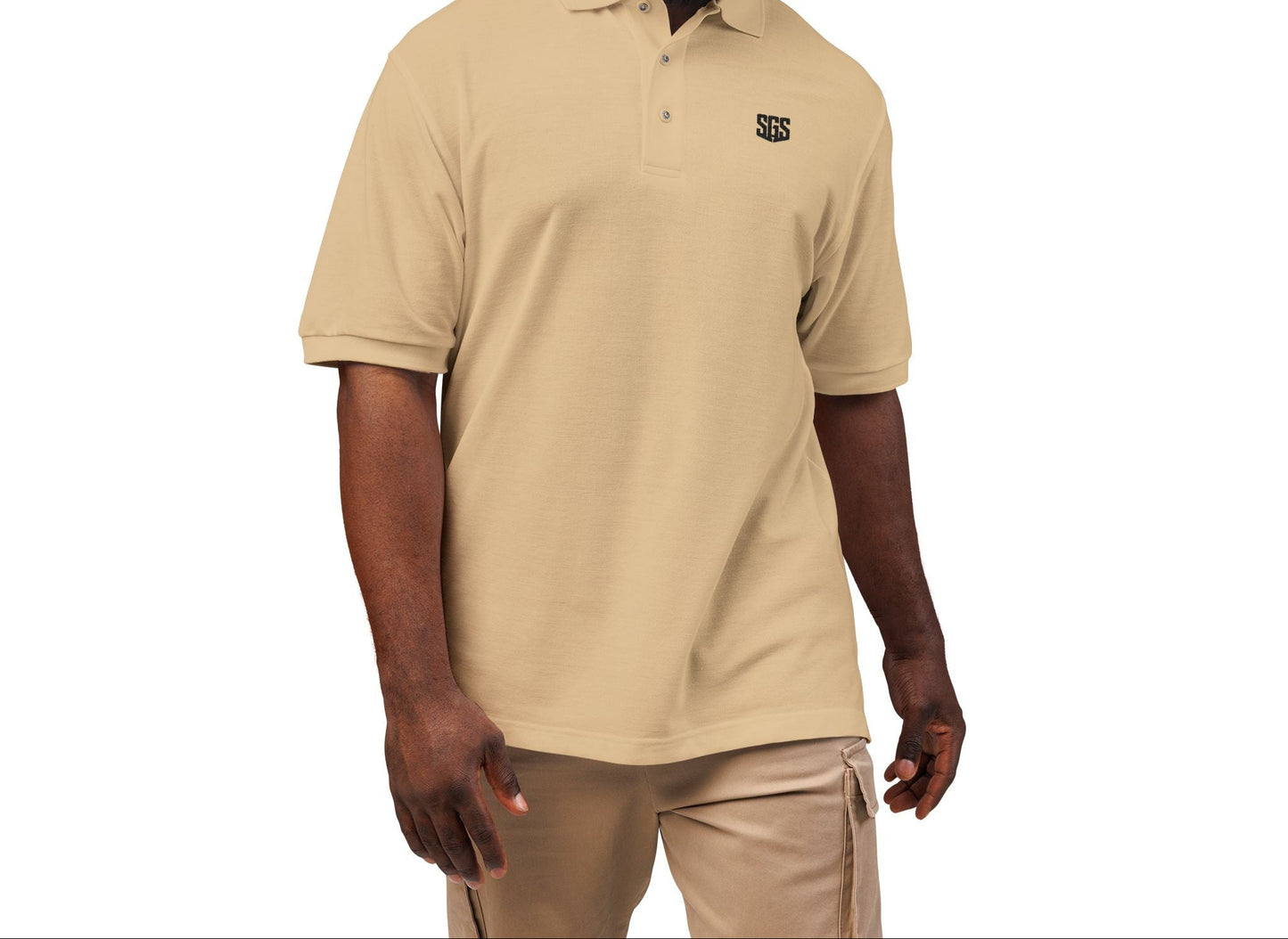 Man wearing a beige polo shirt with a logo on a white background