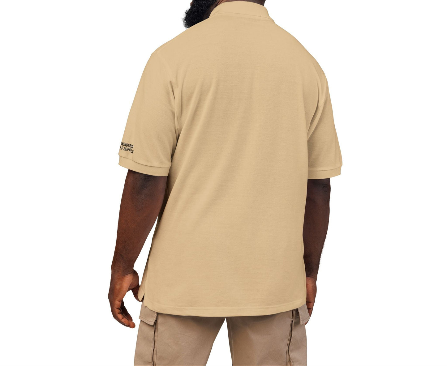 Man wearing a beige polo shirt on a white background