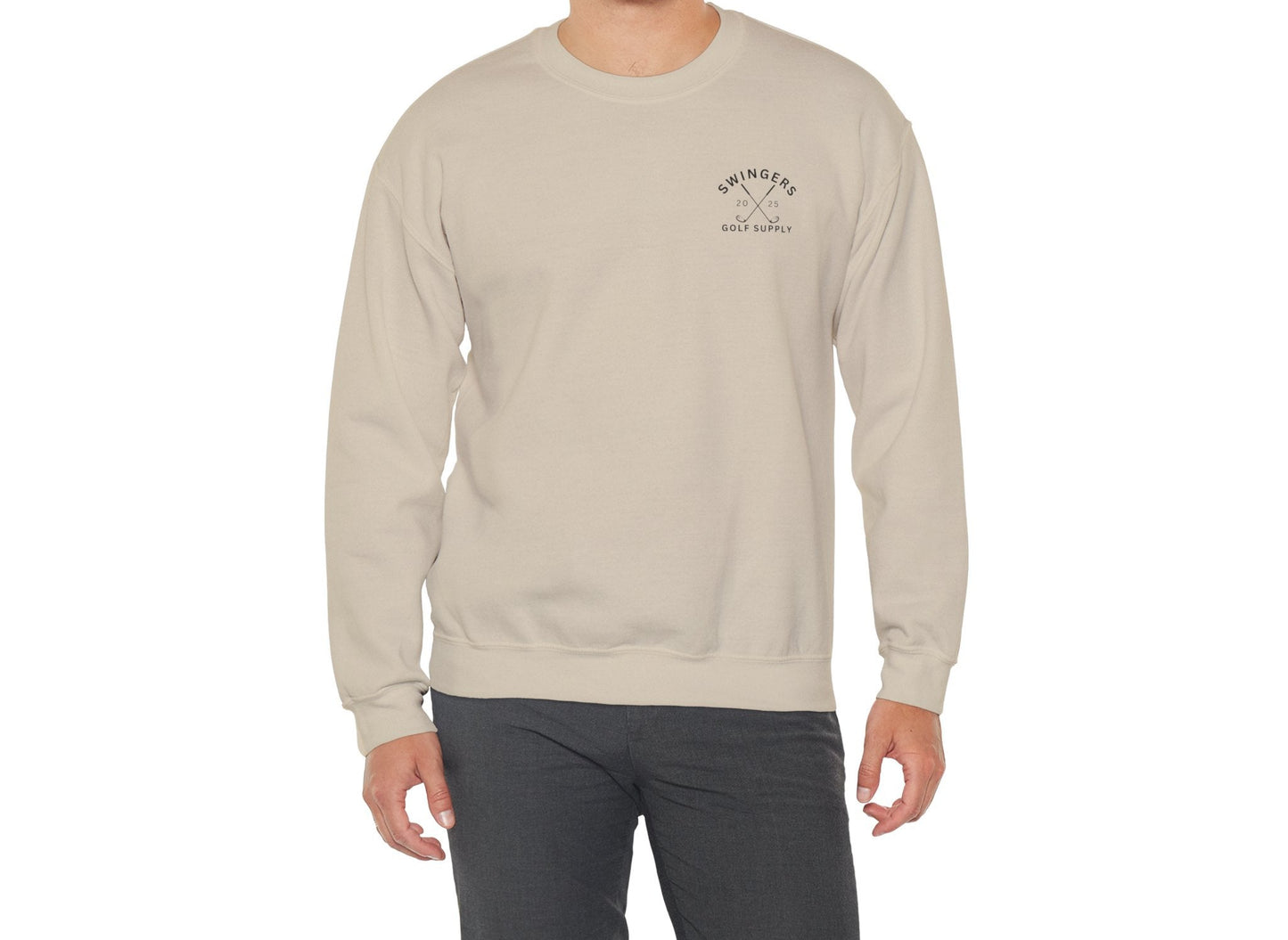 Man wearing a beige sweatshirt with a logo on a white background