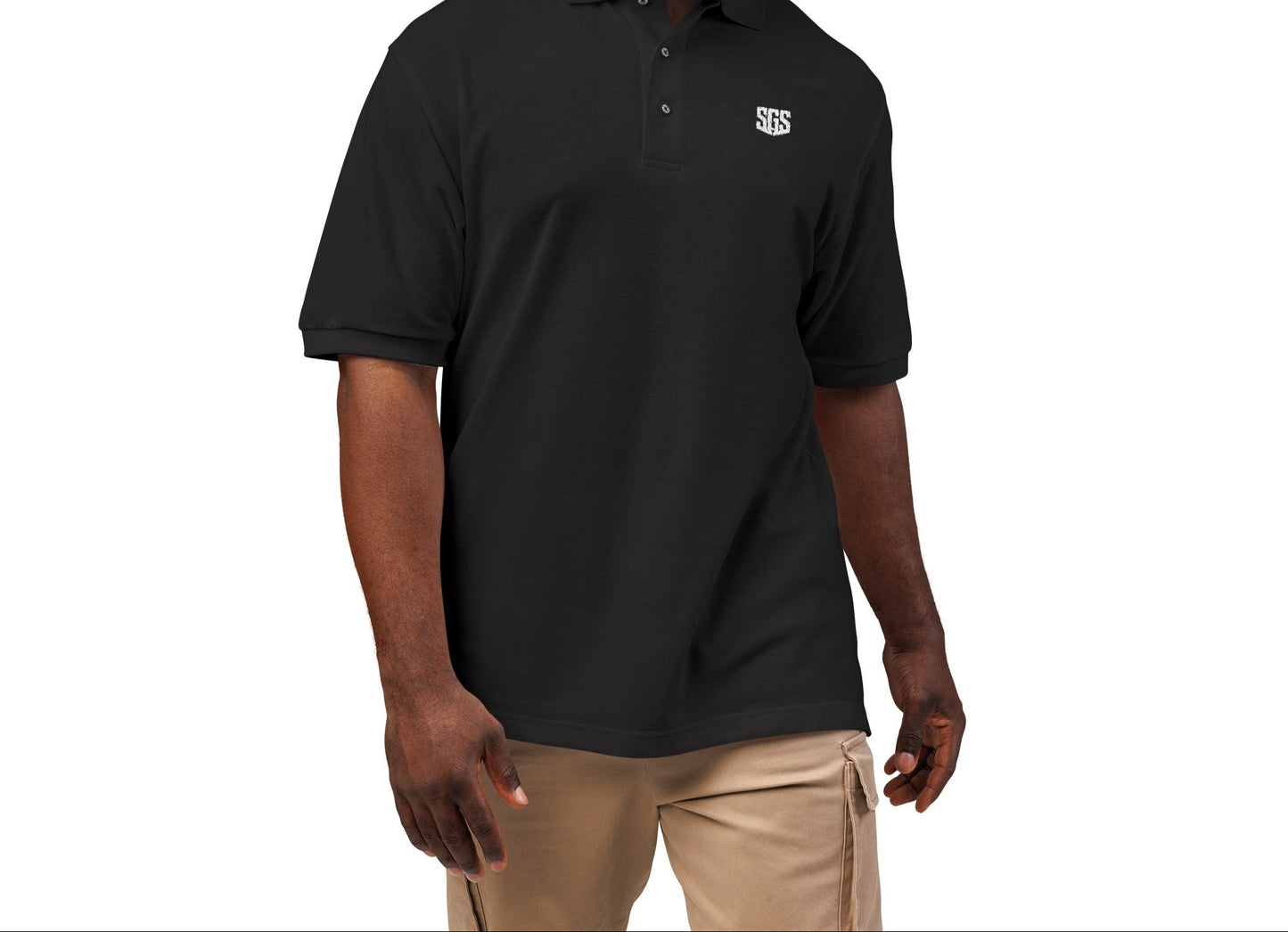 Man wearing a black polo shirt with a logo on a white background