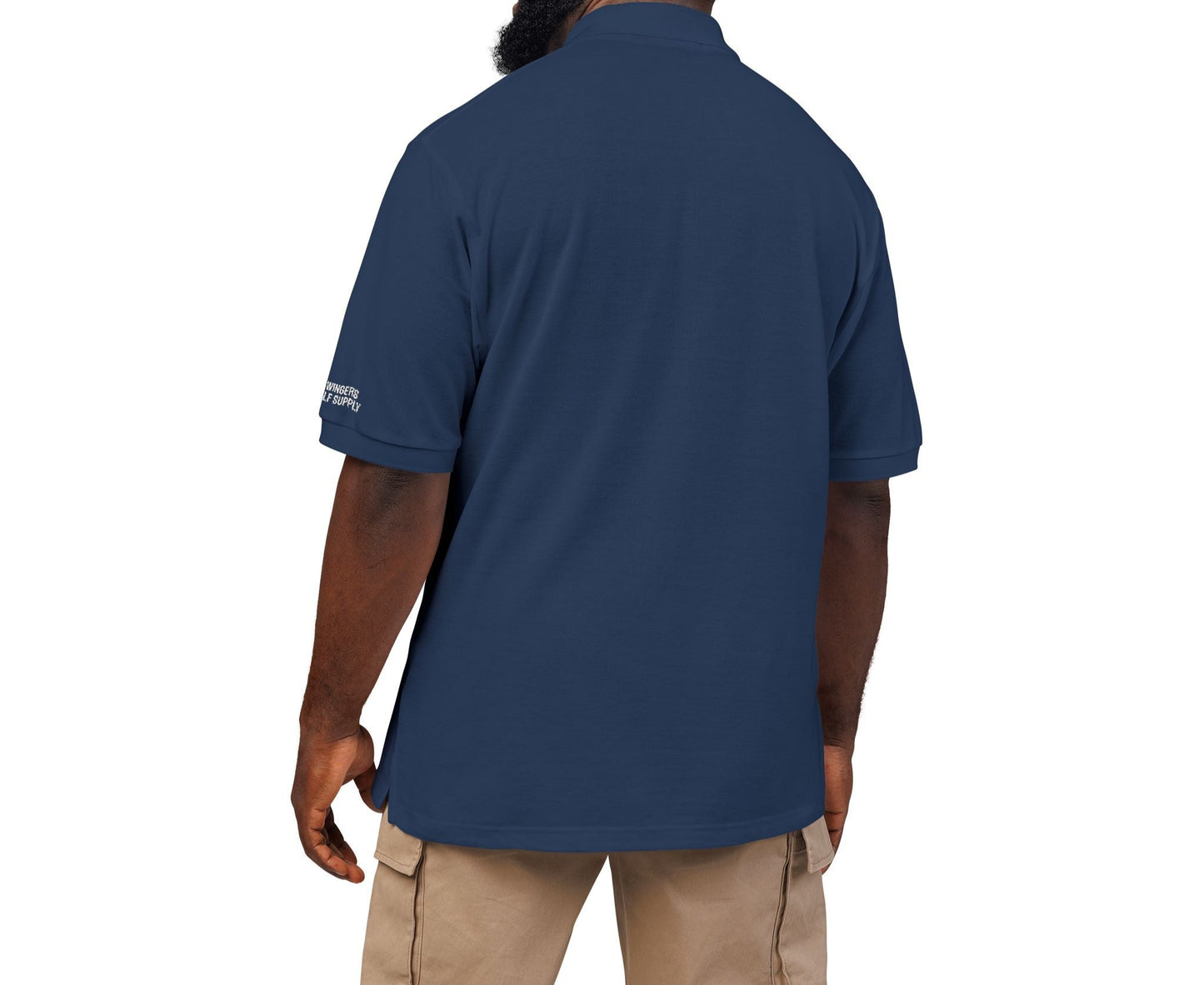 Man wearing a navy blue polo shirt on a white background