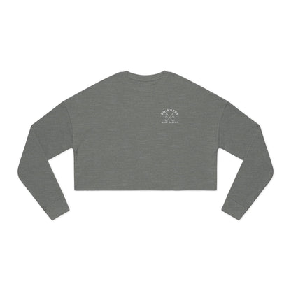 Gray long-sleeve crop top with a logo on a white background