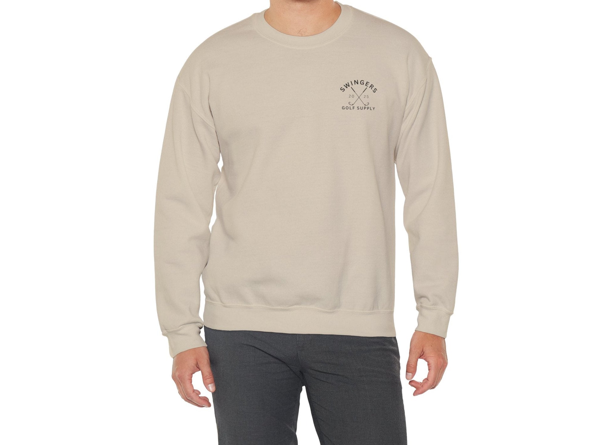 Man wearing a beige sweatshirt with a logo on a white background