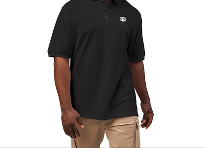 Man wearing a black polo shirt with a logo on a white background