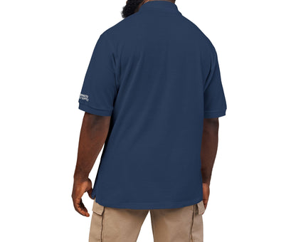 Man wearing a navy blue polo shirt on a white background