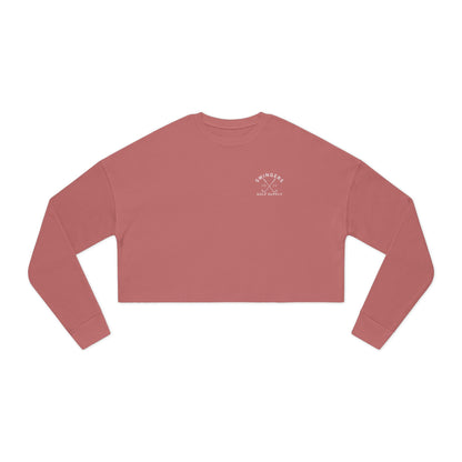 Red long-sleeve crop top with a logo on a white background