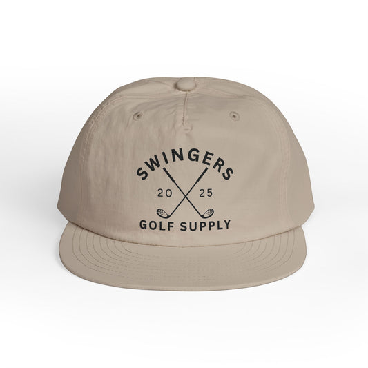 Beige cap with 'Swingers Golf Supply' text and golf club graphics on a white background